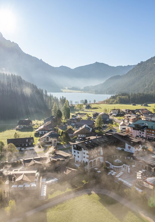 Drone shot: Hotel Tyrol at Haldensee in the fog
