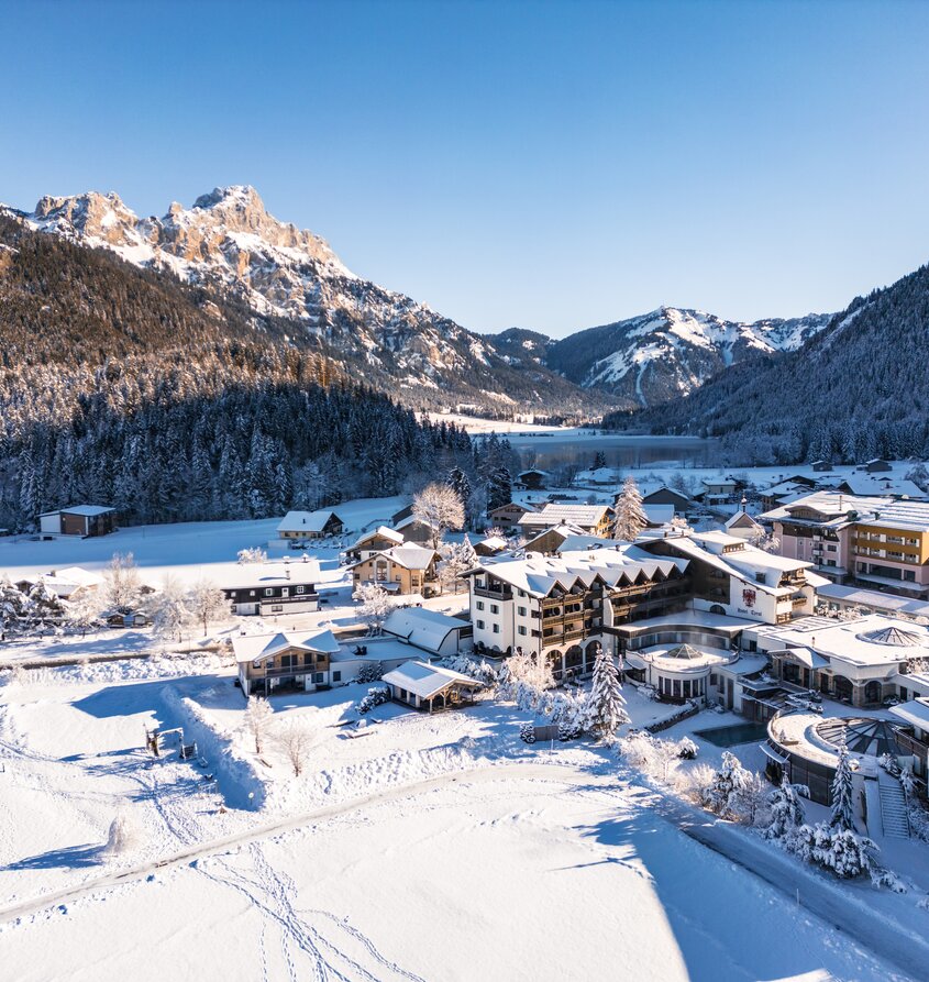 Hotel Tyrol at Lake Haldensee in winter with snow and mountains