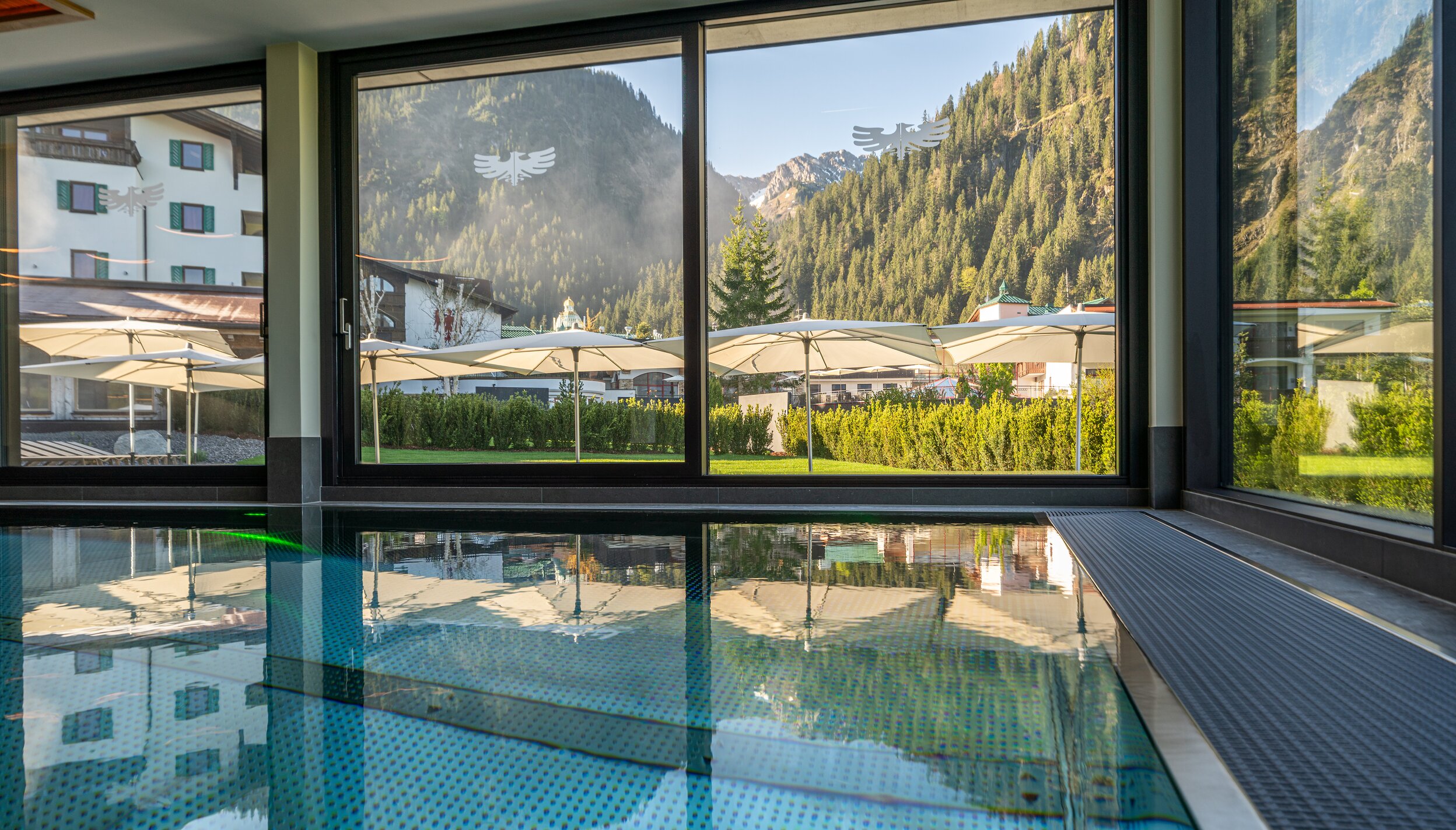 Indoor pool at Hotel Tyrol with mountain views