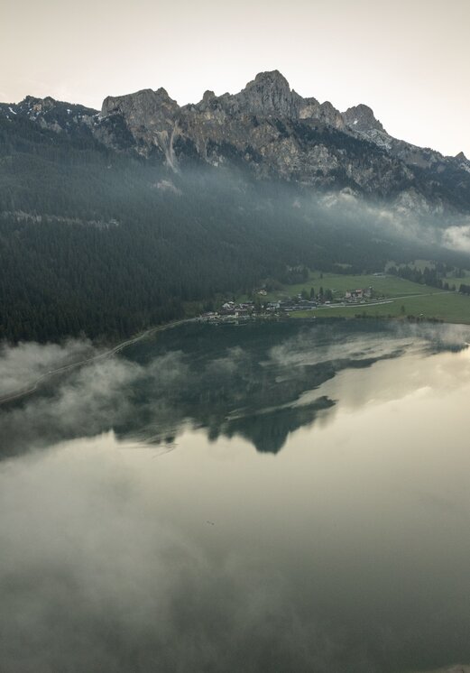 Drone shot: Haldensee, mountains, Hotel Tyrol in the background
